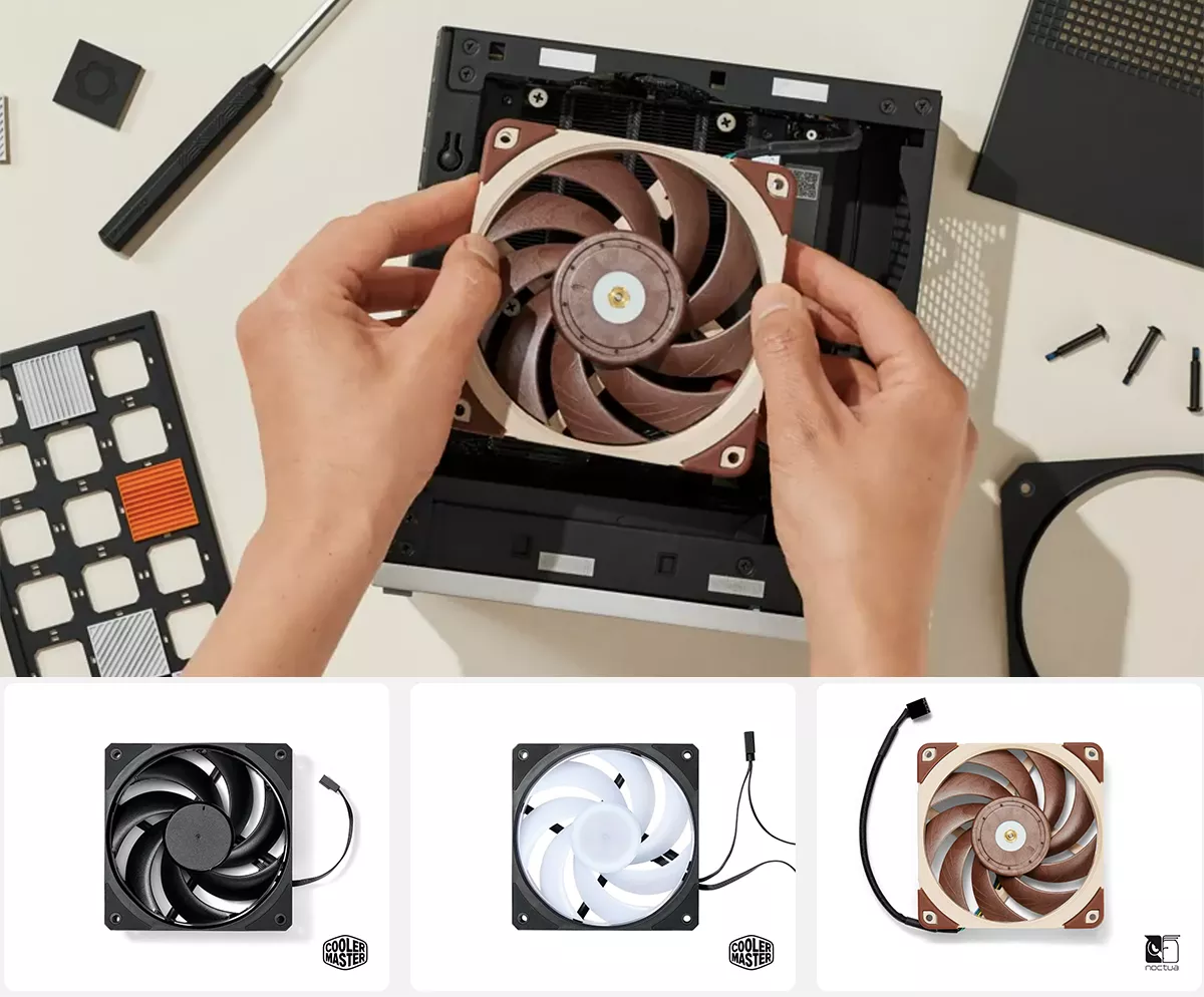 A person's hand installs a cooling fan inside the framework desktop case, surrounded by tools and various PC components on a light background.